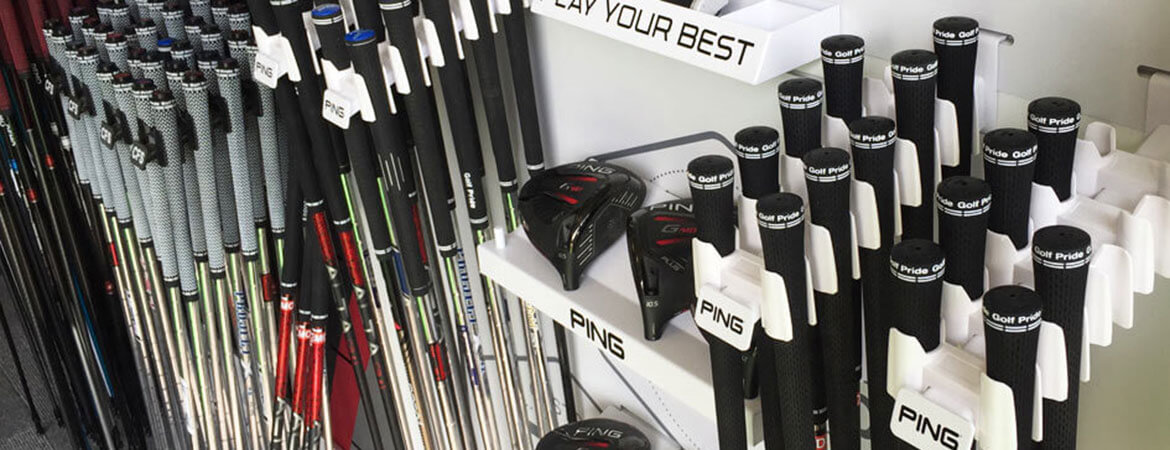 A collection of golf club shafts and heads.
